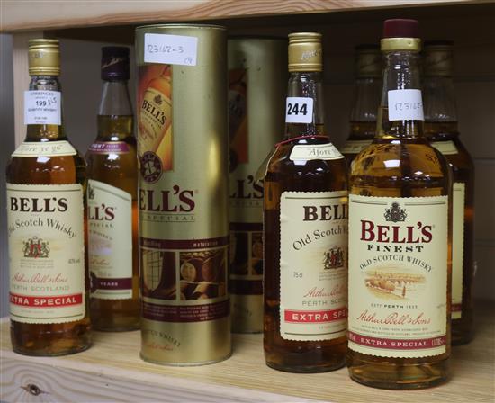 Bells 8 year old whisky (3 in box), 2 x Bells Extra Special whisky, and 1 x litre Bells Extra Special Whisky